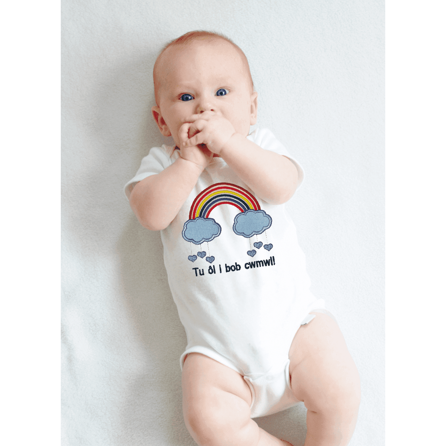 BRO-009 babygrow, welsh text, embroidered rainbow